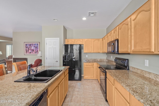 kitchen with sink, light brown cabinetry, black appliances, and light tile flooring