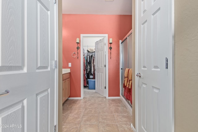 hall featuring light tile floors