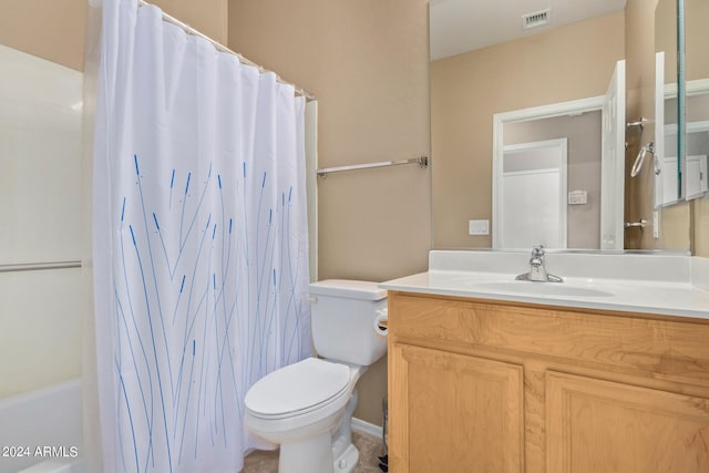 bathroom featuring toilet and vanity