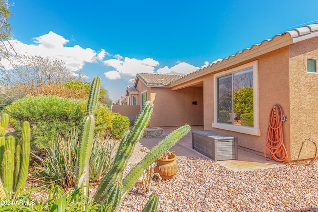 view of side of home featuring a patio