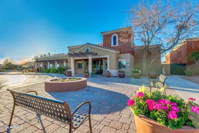 rear view of property featuring a patio area