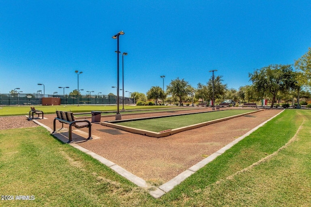 view of property's community featuring a lawn