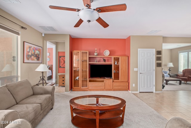 living room featuring ceiling fan and light tile floors