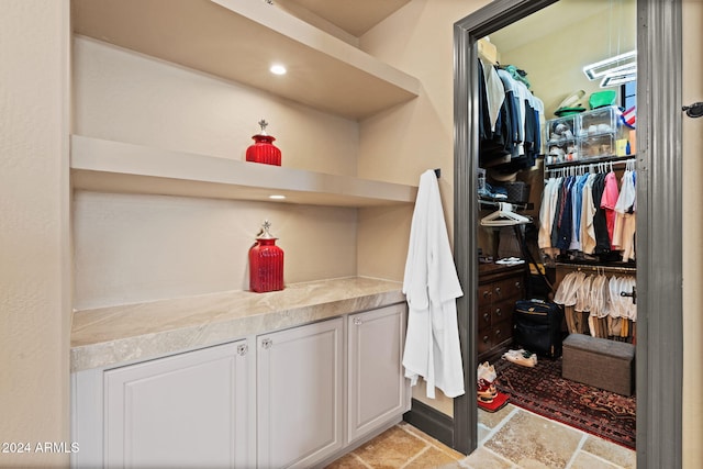 2549 W Shinnecock Way, Anthem, AZ 85086 - spacious closet featuring light stone finish flooring