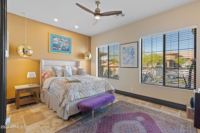 2549 W Shinnecock Way, Anthem, AZ 85086 - bedroom with stone tile flooring, recessed lighting, baseboards, and ceiling fan