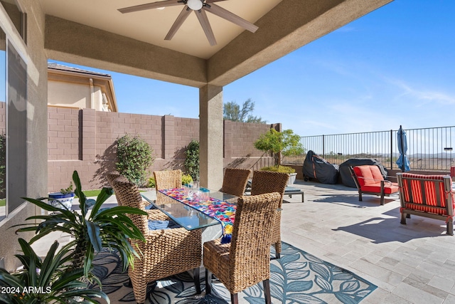 2549 W Shinnecock Way, Anthem, AZ 85086 - fenced backyard with outdoor dining area, a patio area, and a ceiling fan
