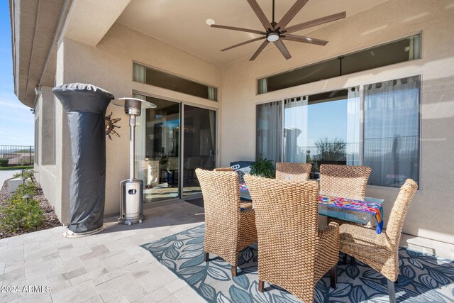 view of patio / terrace featuring ceiling fan