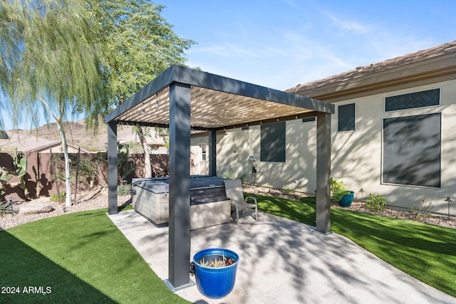 view of patio / terrace with a pergola and a hot tub