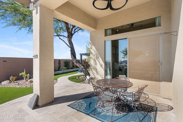 view of patio featuring ceiling fan