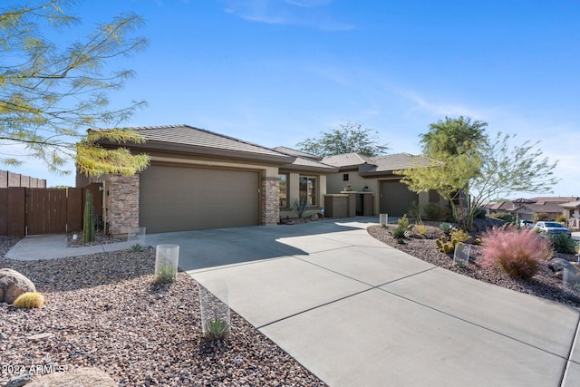 2549 W Shinnecock Way, Anthem, AZ 85086 - prairie-style house featuring an attached garage, concrete driveway, stucco siding, and stone siding