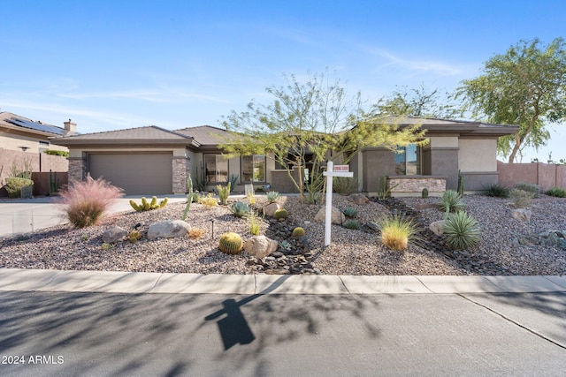 2549 W Shinnecock Way, Anthem, AZ 85086 - prairie-style home featuring stucco siding, an attached garage, concrete driveway, and stone siding