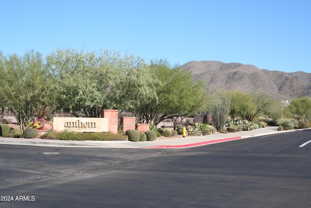 2549 W Shinnecock Way, Anthem, AZ 85086 - view of asphalt road with sidewalks, a mountain view, and curbs