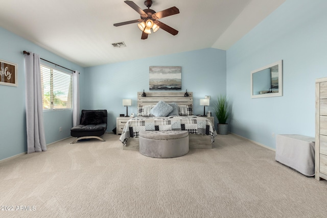 carpeted bedroom featuring vaulted ceiling and ceiling fan