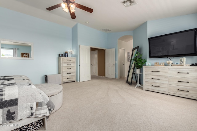 bedroom with light carpet and ceiling fan