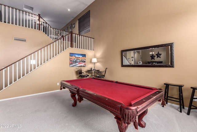 recreation room featuring billiards, a high ceiling, and carpet