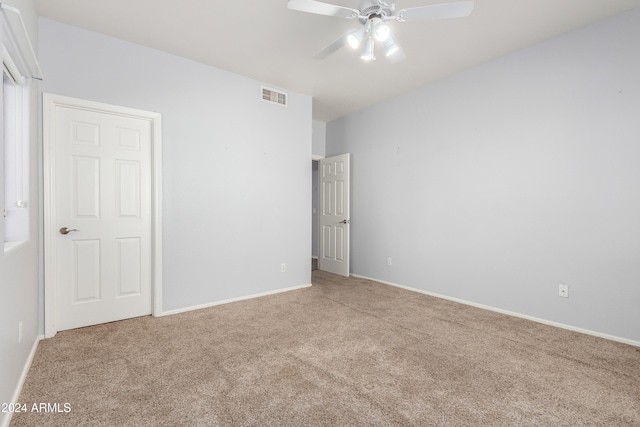 unfurnished bedroom with ceiling fan and carpet floors