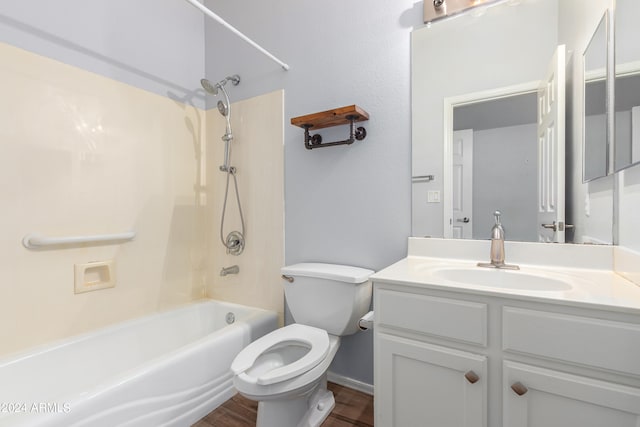 full bathroom with toilet, shower / washtub combination, hardwood / wood-style floors, and vanity