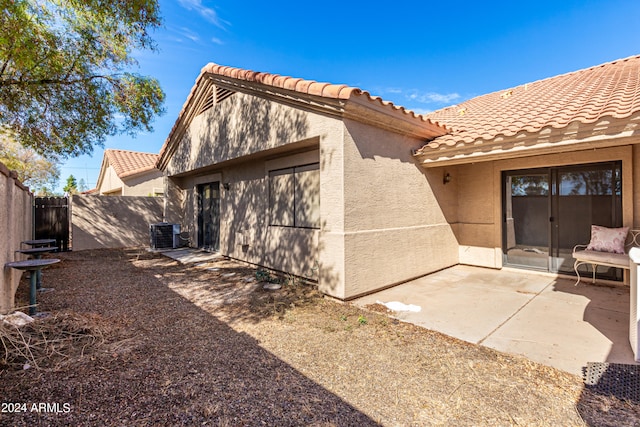 back of property featuring a patio and central air condition unit