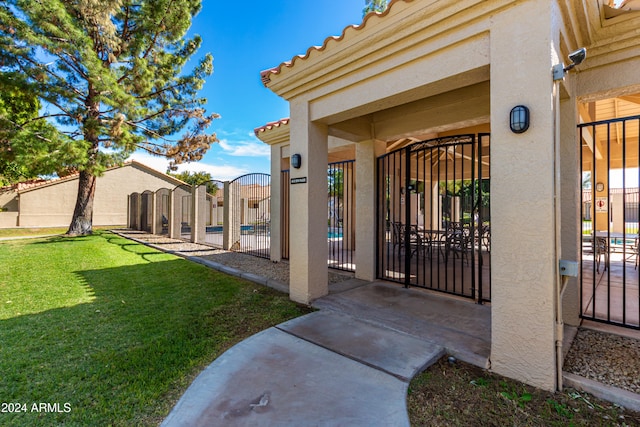 doorway to property with a yard