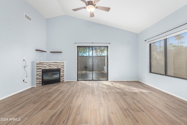 unfurnished living room featuring light hardwood / wood-style floors, lofted ceiling, and ceiling fan