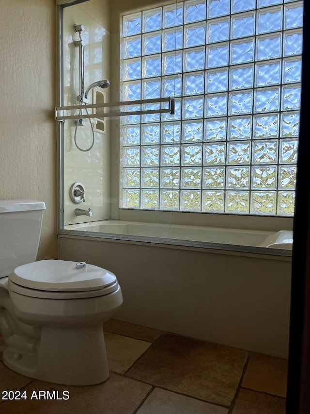 bathroom featuring a wealth of natural light, shower / tub combination, and tile patterned floors