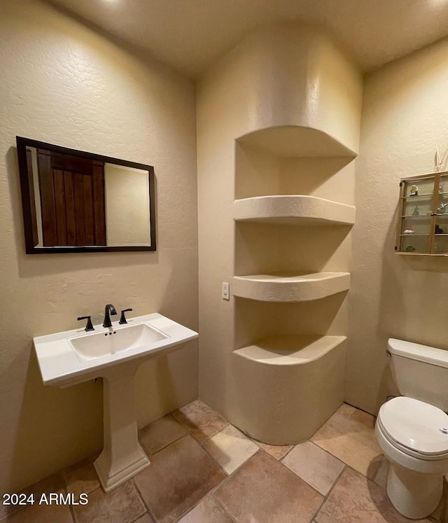 bathroom featuring toilet