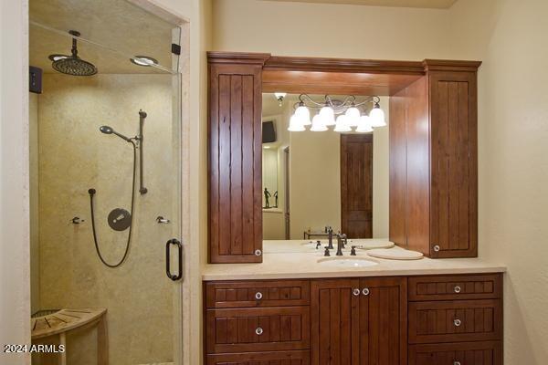 bathroom with an enclosed shower and vanity