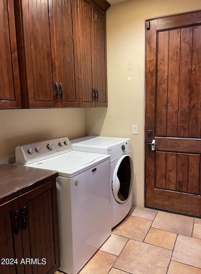 laundry area featuring cabinets and independent washer and dryer