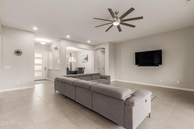 tiled living room with ceiling fan