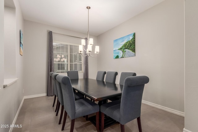 dining area with an inviting chandelier