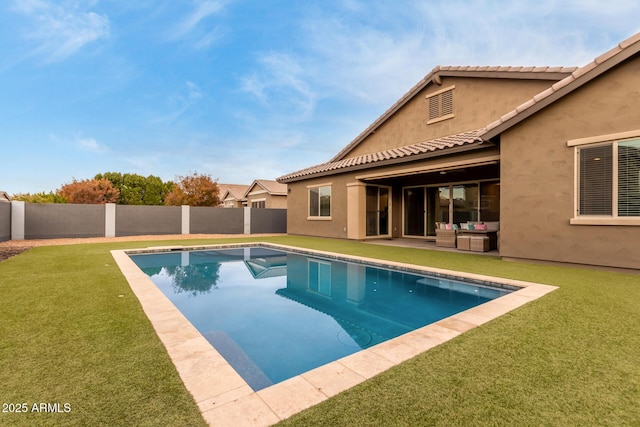 view of swimming pool with a patio area and a lawn