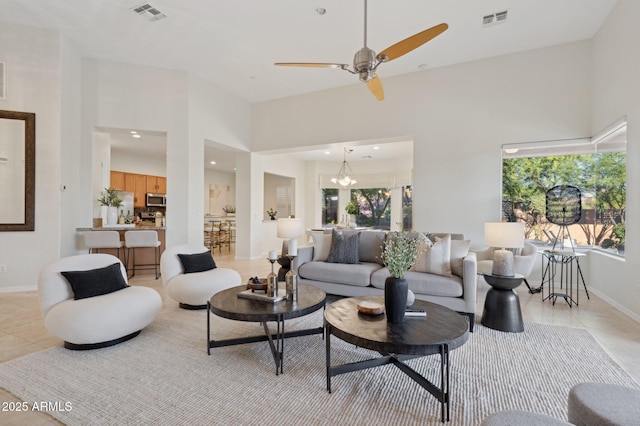 11299 E Greythorn Dr, Scottsdale, AZ 85262 - living room featuring light tile patterned floors, a ceiling fan, recessed lighting, and a chandelier