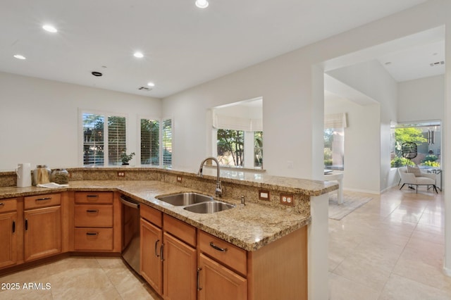 11299 E Greythorn Dr, Scottsdale, AZ 85262 - kitchen featuring stainless steel dishwasher, light stone counters, light tile patterned floors, recessed lighting, and brown cabinetry