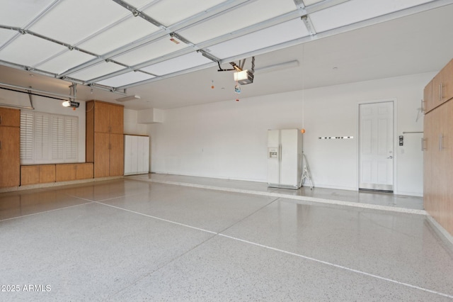 11299 E Greythorn Dr, Scottsdale, AZ 85262 - garage with a garage door opener and white refrigerator with ice dispenser