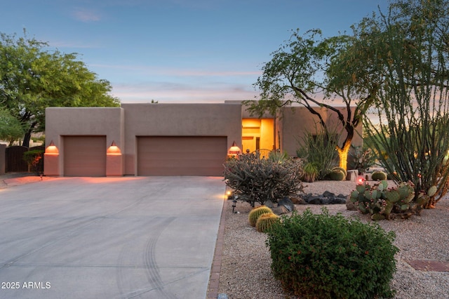 11299 E Greythorn Dr, Scottsdale, AZ 85262 - pueblo revival-style home with stucco siding, a garage, and concrete driveway