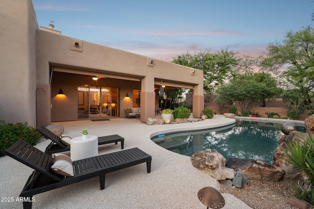 11299 E Greythorn Dr, Scottsdale, AZ 85262 - pool at dusk with a patio area, a fenced backyard, and an outdoor living space