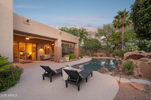 11299 E Greythorn Dr, Scottsdale, AZ 85262 - pool at dusk featuring a patio, outdoor lounge area, an outdoor pool, and a fenced backyard