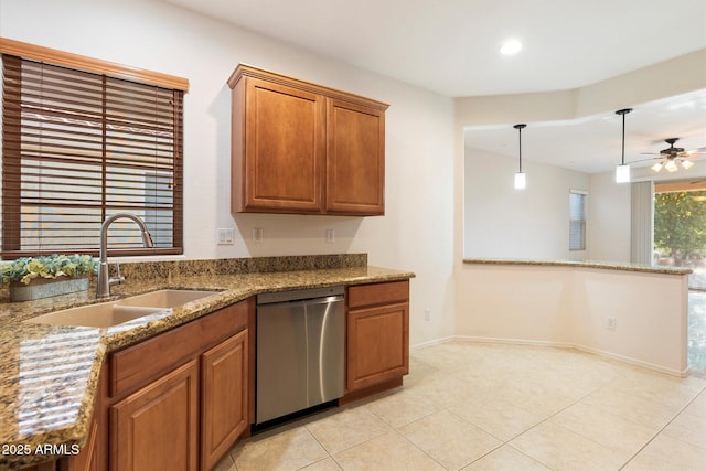 kitchen with ceiling fan, dishwasher, sink, hanging light fixtures, and light tile patterned flooring