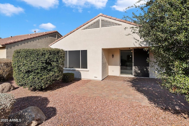 back of house featuring a patio area