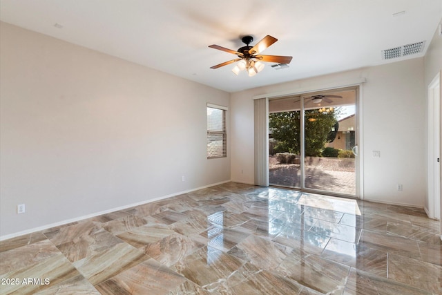 spare room with ceiling fan