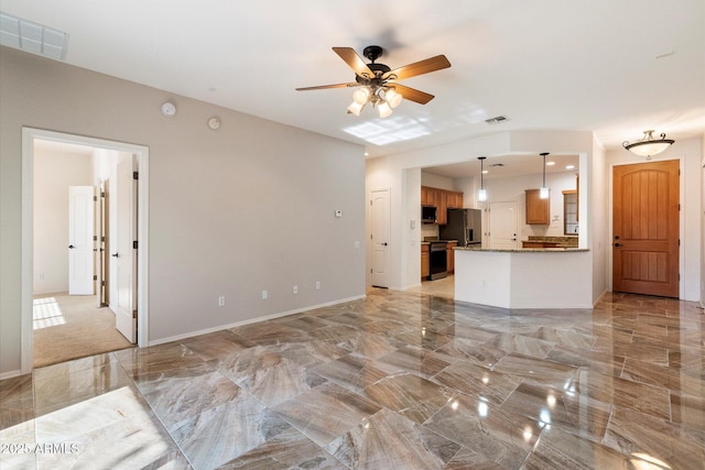 unfurnished living room with ceiling fan