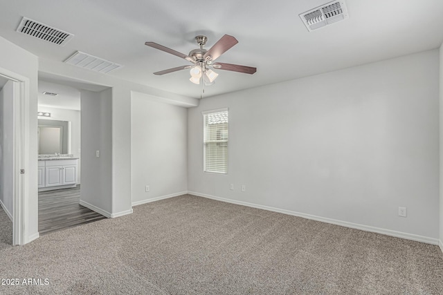 923 E Agua Fria Ln, Avondale, AZ 85323 - empty room with carpet and ceiling fan