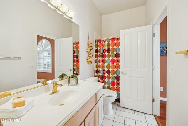 bathroom with vanity, tile patterned floors, curtained shower, and toilet