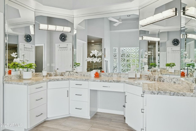 bathroom with vanity and a ceiling fan