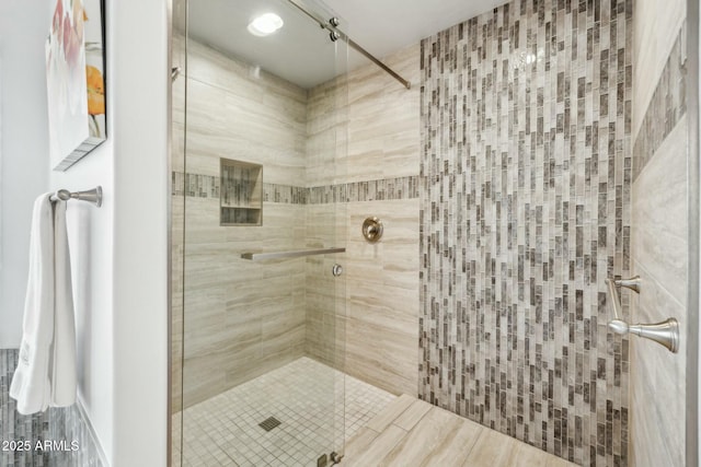 full bath featuring a shower stall