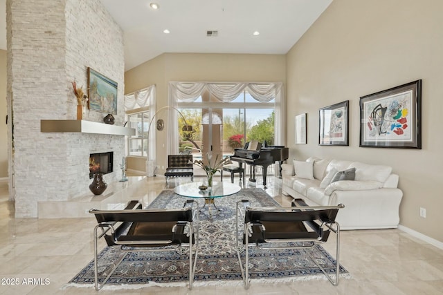 living area with visible vents, baseboards, a stone fireplace, recessed lighting, and marble finish floor