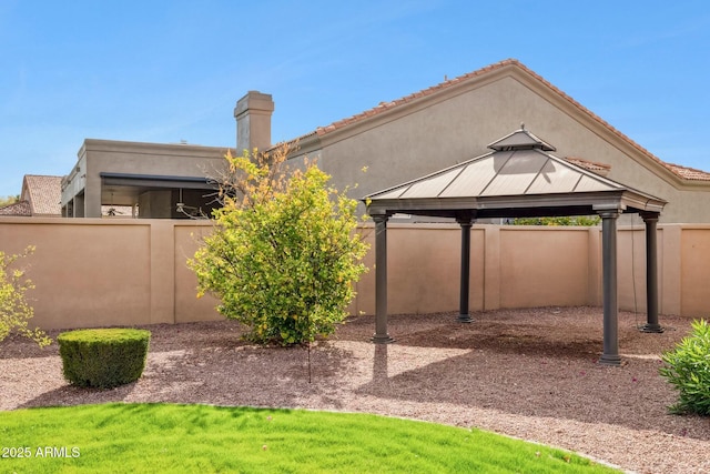 view of yard with a gazebo and fence