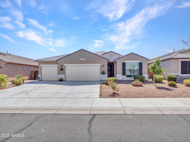 ranch-style house featuring stucco siding, driveway, an attached garage, and a tile roof