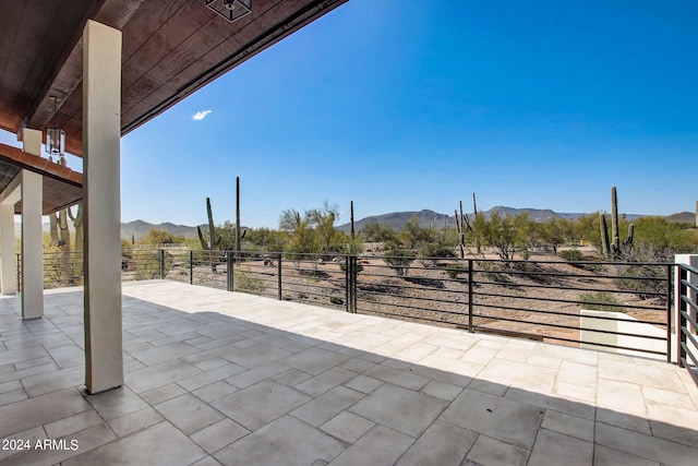 view of patio / terrace with a mountain view