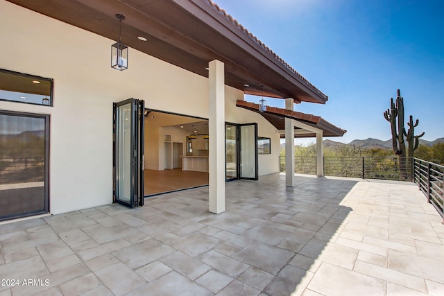 view of patio / terrace with a mountain view